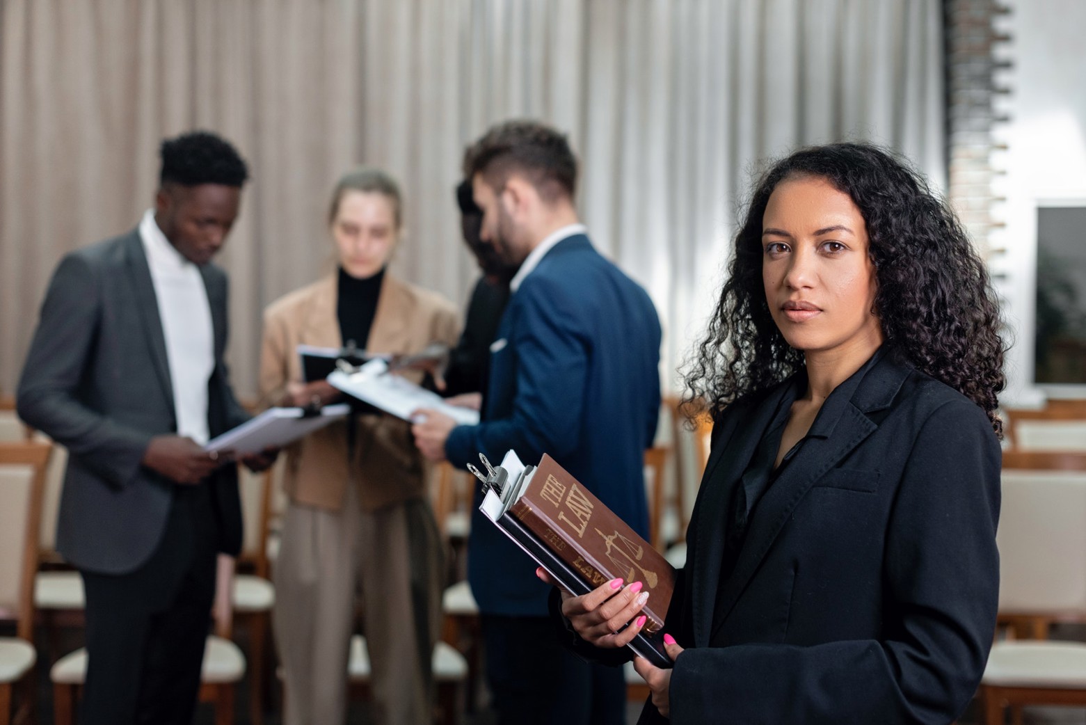 Conference organizer holding books