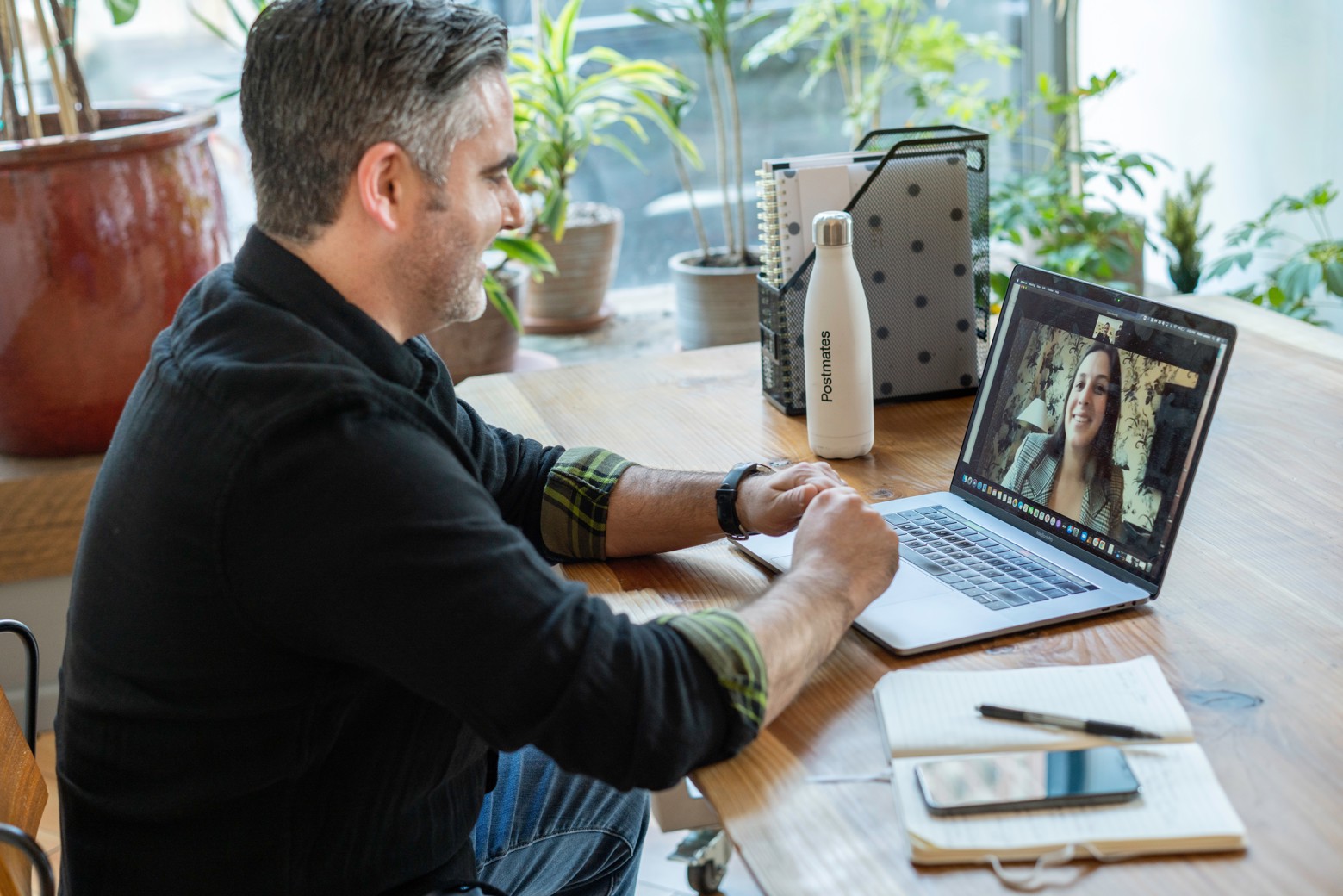 Conference organizer doing a zoom call on a laptop